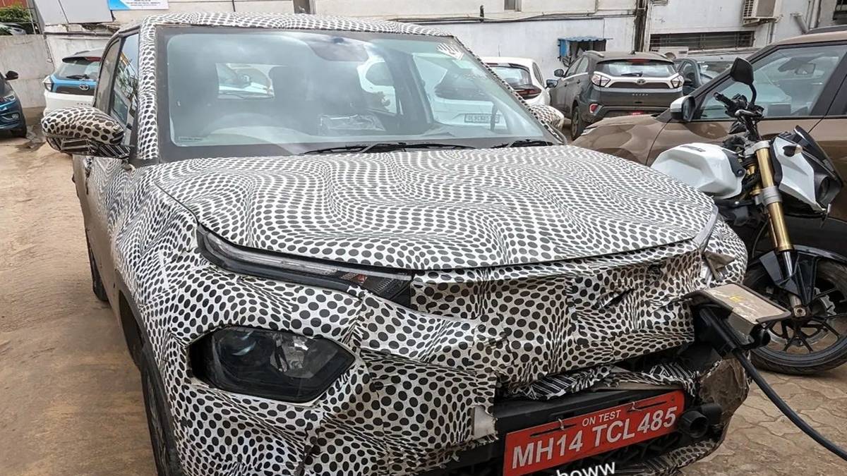 Tata Punch EV spotted while charging ahead of launch, may feature front charging slot