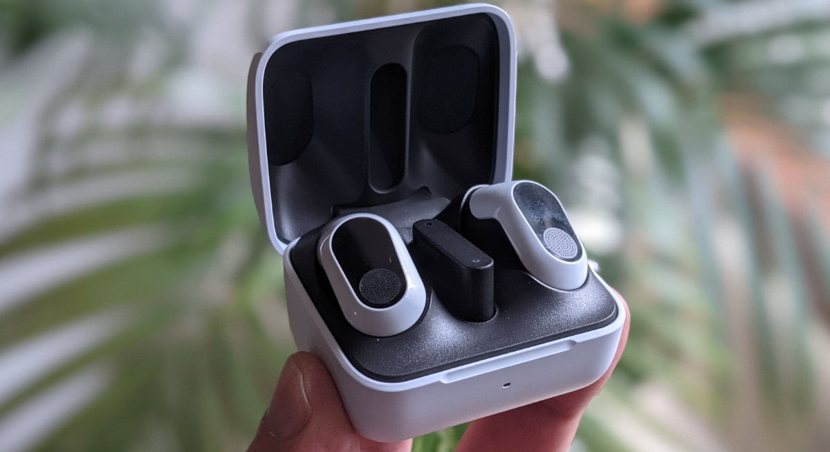 Sony InZone Buds Design - Charging Case with Earbuds and USB C Dongle in hand
