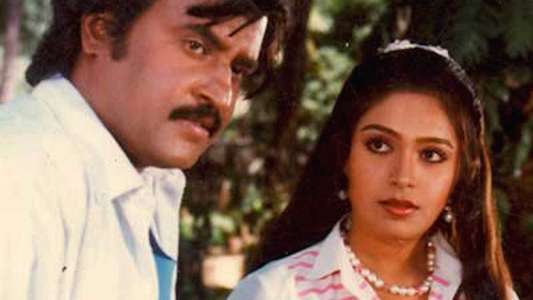 Manithan - Backdrop