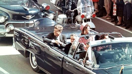 JFK Revisited: Through The Looking Glass - Backdrop