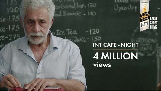INT. CAFÉ – NIGHT - Backdrop